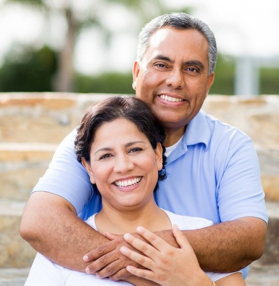 older couple smiling with dental implants in Rockledge 