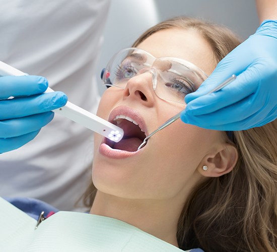 Intraoral camera in woman's mouth