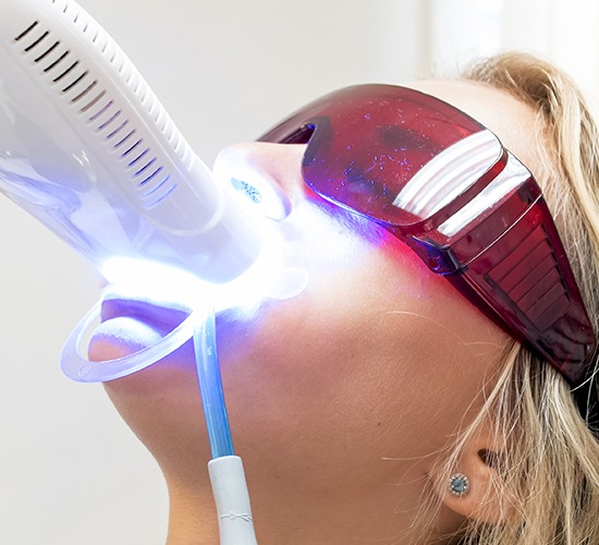 woman having teeth whitening done