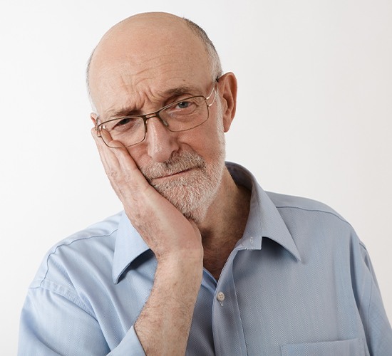 elderly man with dental pain