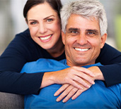 Couple smiling with dental implants in Rockledge 