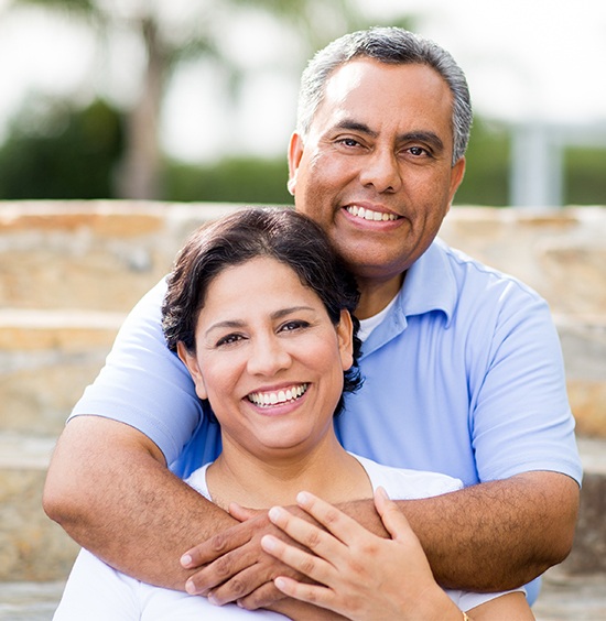 Man and woman smiling at camera