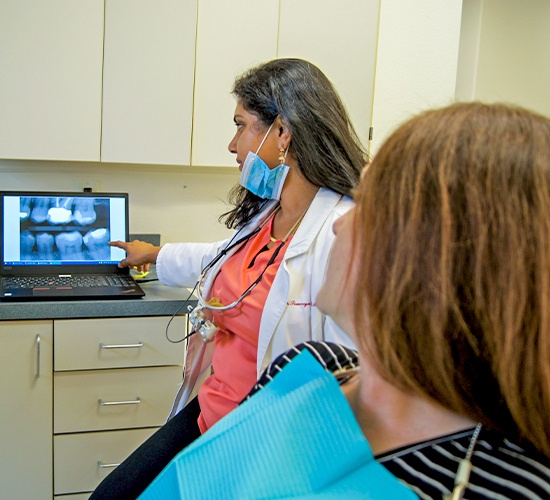 dentist pointing to digital x-ray