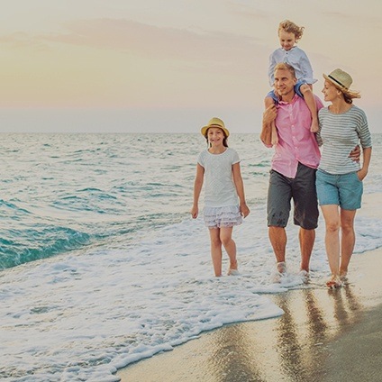 family of four on the beach