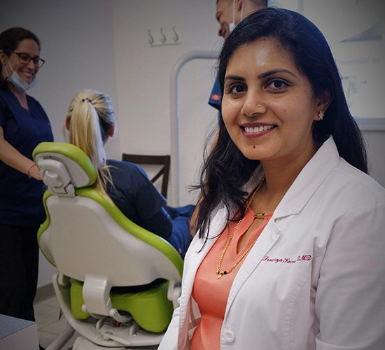 Dr. Kumar smiling in Rockledge exam room