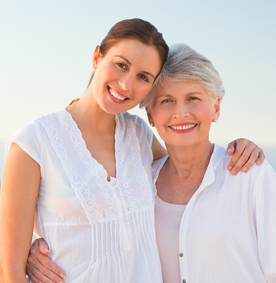 mother and daughter smiling