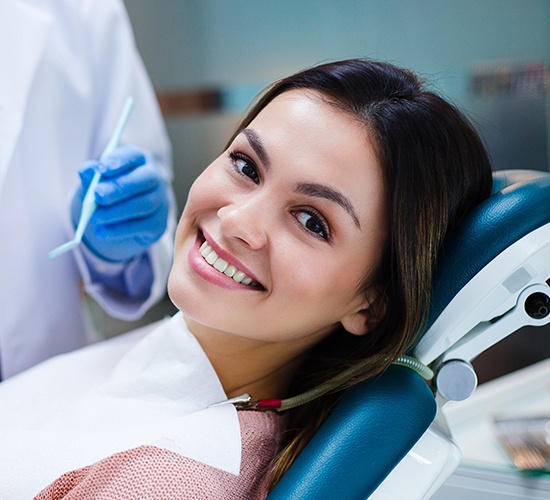 woman in exam chair ready for dental checkup