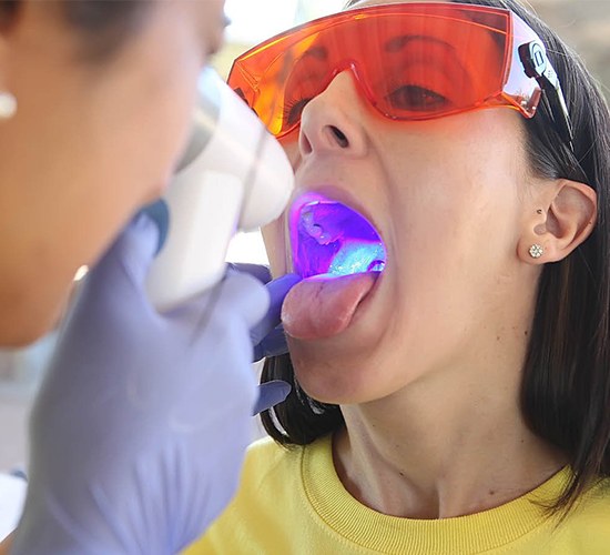 woman having oral cancer screening done