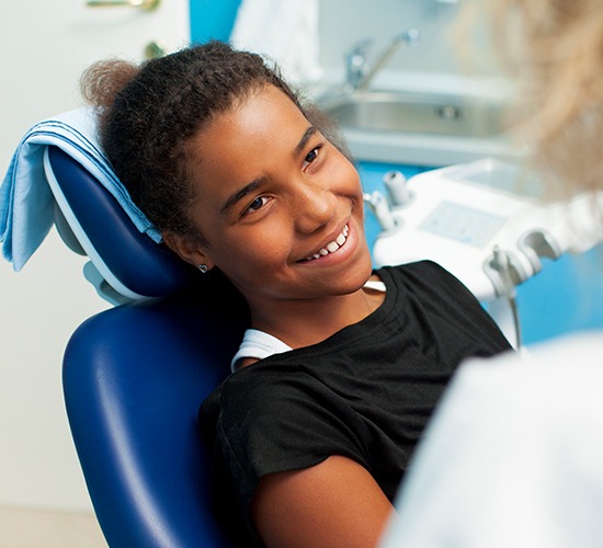 young girl smiling at dentist