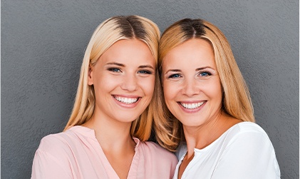 two sisters smiling