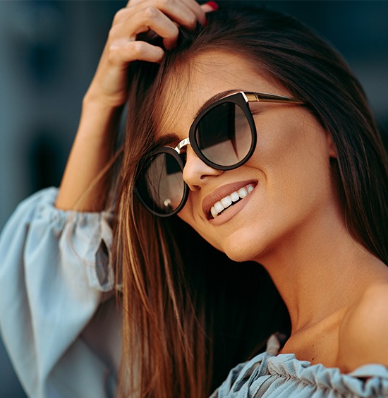 beautiful woman with veneers smiling