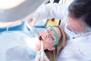 woman having chairside suction use by dentist in Rockledge 
