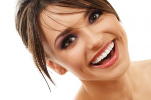 woman smiling with perfectly white teeth