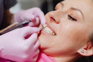 Close up of woman having a veneer replaced